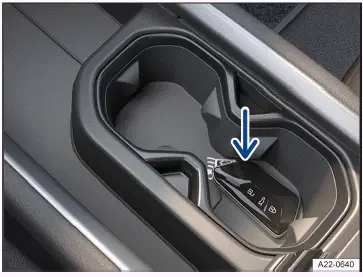 Fig. 1 In the center armrest: Emergency start function.